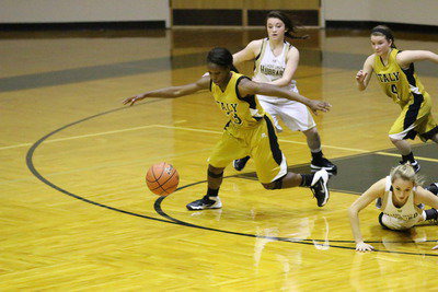 Image: Kortnei Johnson(3) steals the ball and then pushes the ball up court.