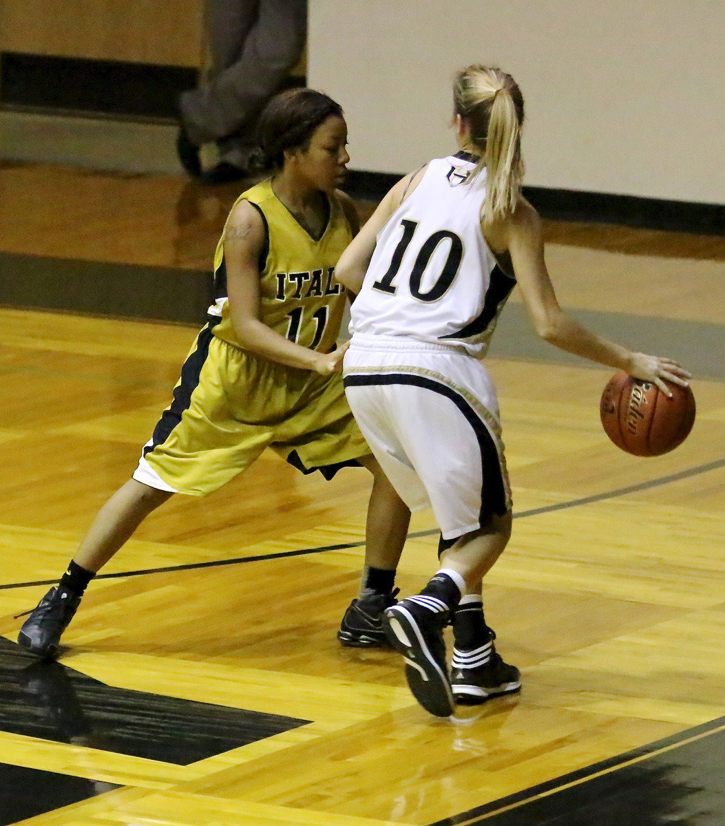 Image: Ryisha Copeland(11) closes in on a Hubbard ball handler.