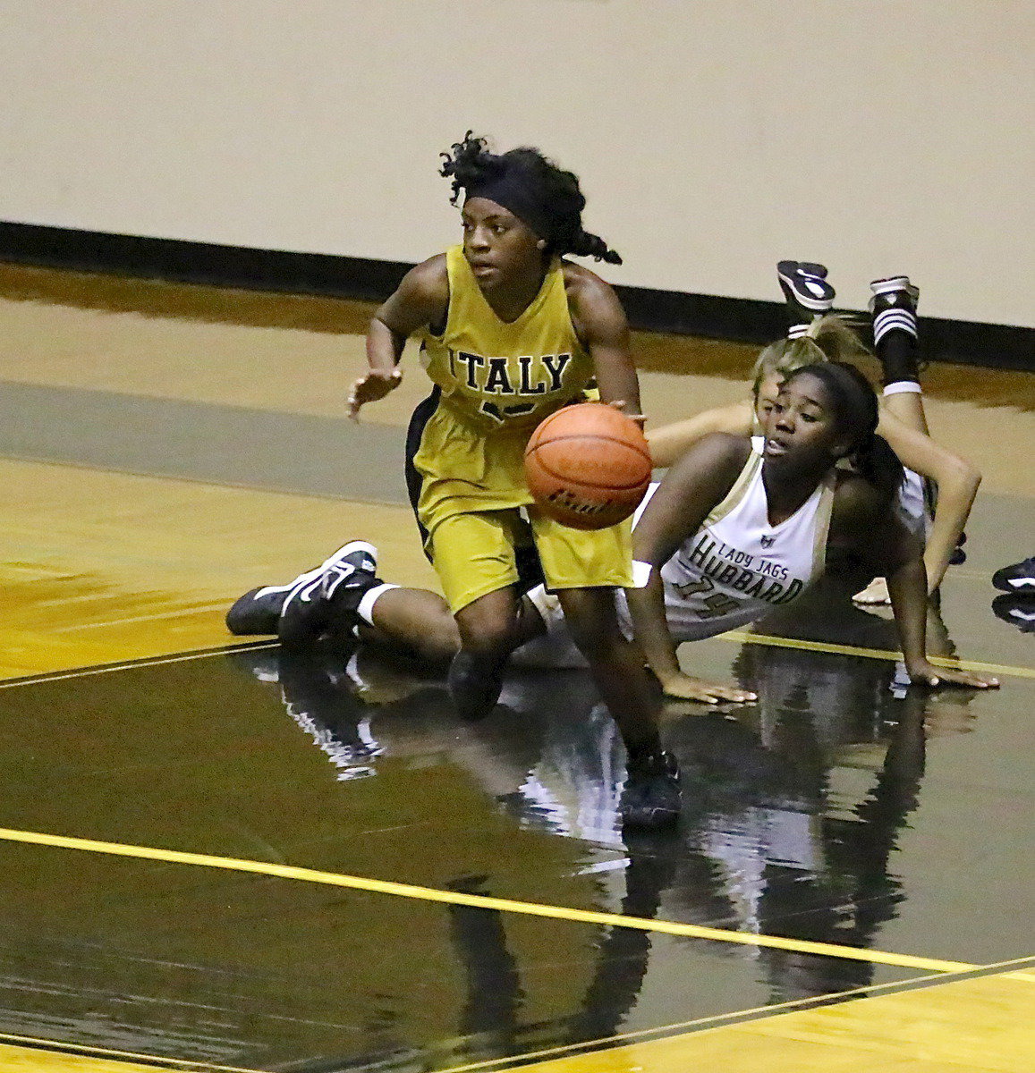 Image: Kendra Copeland(10) emerges from the fray with the ball.