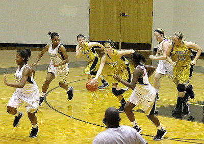 Image: Halee Turner(5) gets the rebound and then charges up the court.