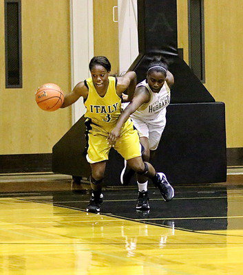 Image: Kortnei Johnson(3) rebounds and then pulls away from a Hubbard defender.