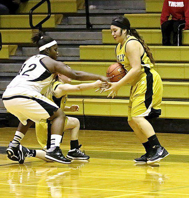 Image: Monserrat Figueroa(15) and teammate Tara Wallis(4) try to take control the ball.