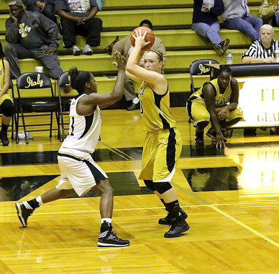 Image: Jaclynn Lewis(13) looks for an open teammate.