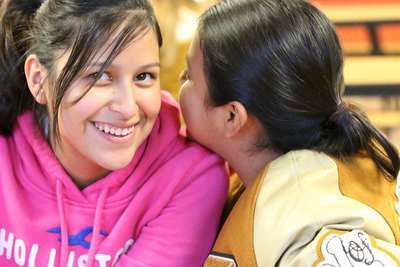 Image: Cheerleader Jessica Garcia and sister and mascot Noeli Garcia keep secrets from Collinsville.