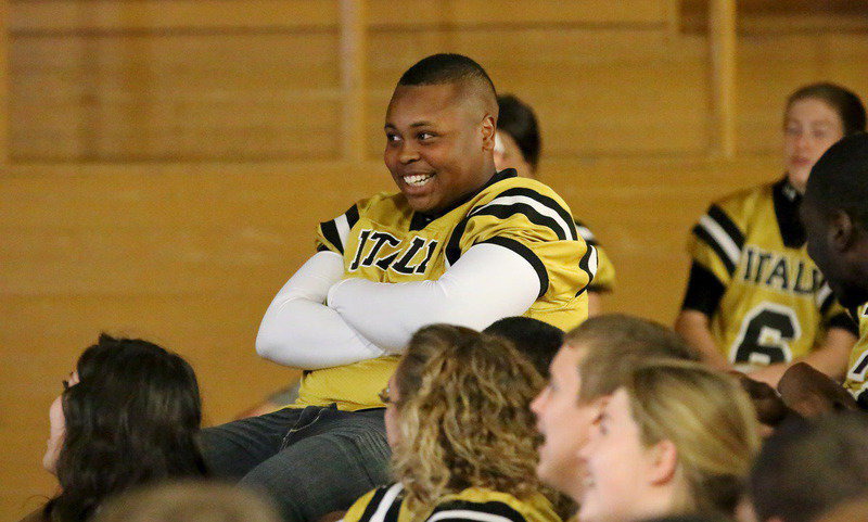 Image: That moment your baby picture flashes up on the screen during the Senior Night pep rally—Darol Mayberry responds to his cuteness.