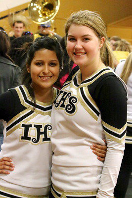 Image: Senior cheerleaders Jessica Garcia and Taylor Turner.
