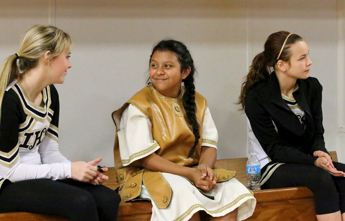 Image: Kelsey Nelson, mascot Noeli Garcia and Paige Little enjoy the senior slide show.