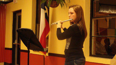 Image: Sarah Levy, freshman, performs for the school board Monday night as the Italy Gladiator Regiment Band was recognized for its accomplishments.