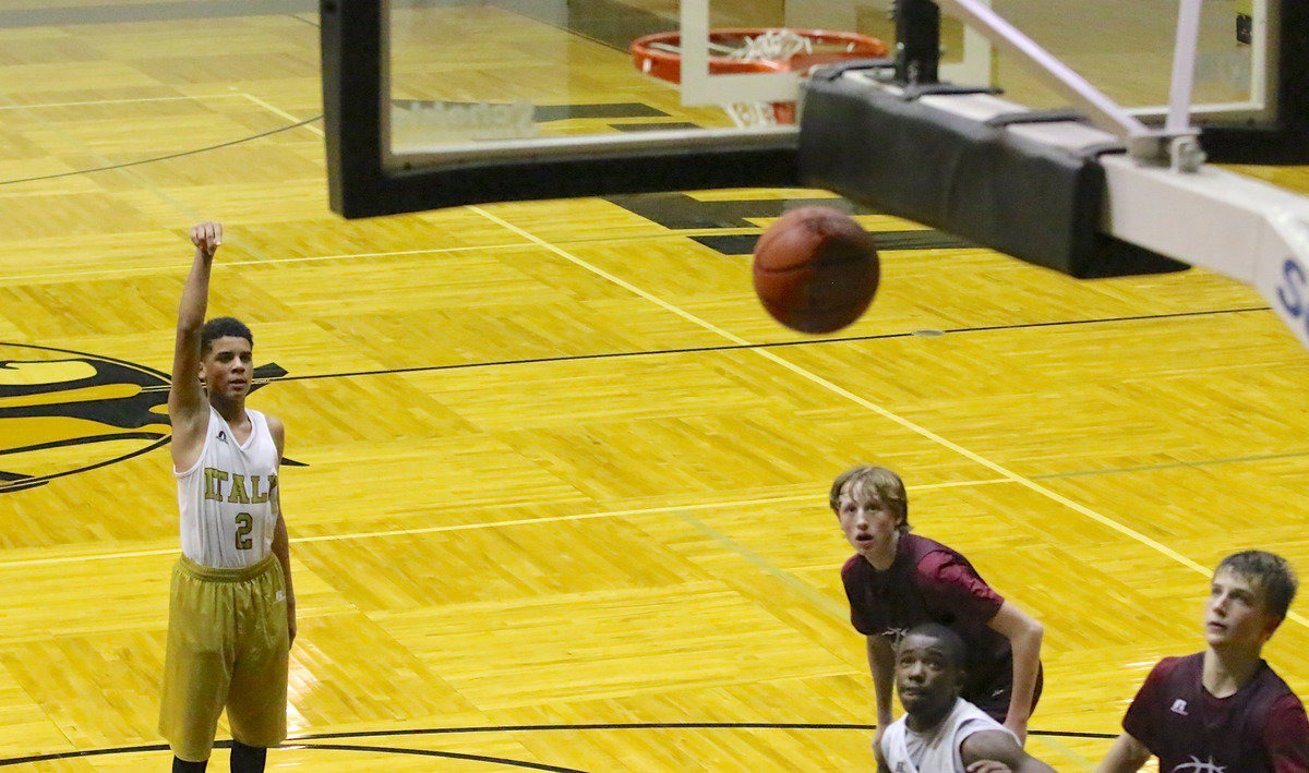 Image: 8th grader Tylan Wallace(2) swishes in a free shot for Italy.