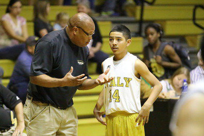 Image: Larry Mayberry, Sr., asks point guard Marcos Duarte(14), "How did he get so good?