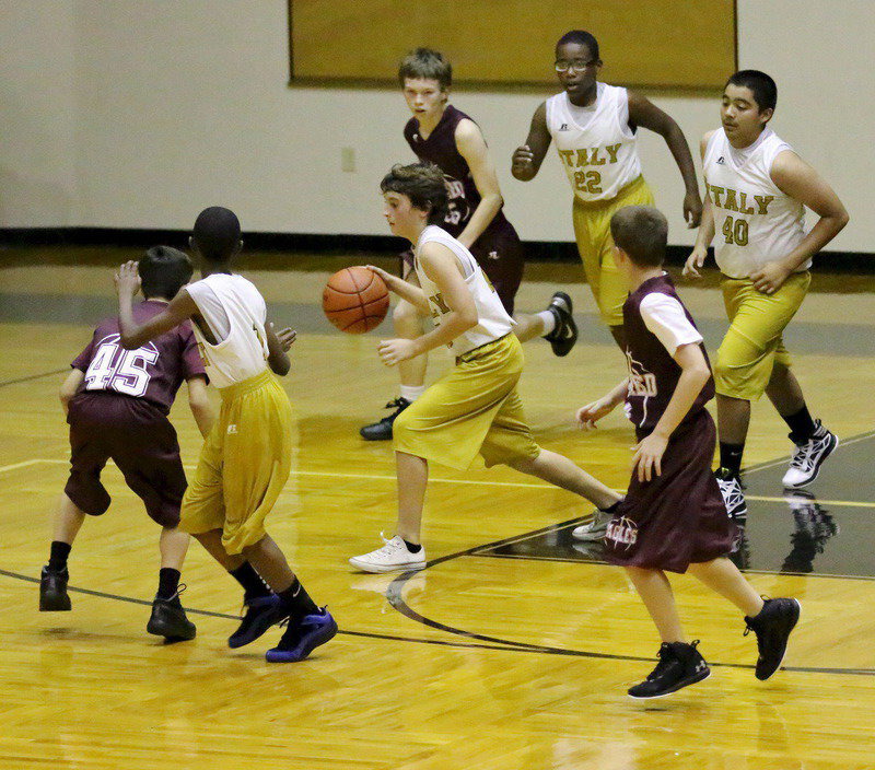 Image: Andrew Oldfied(13) dribbles thru traffic.