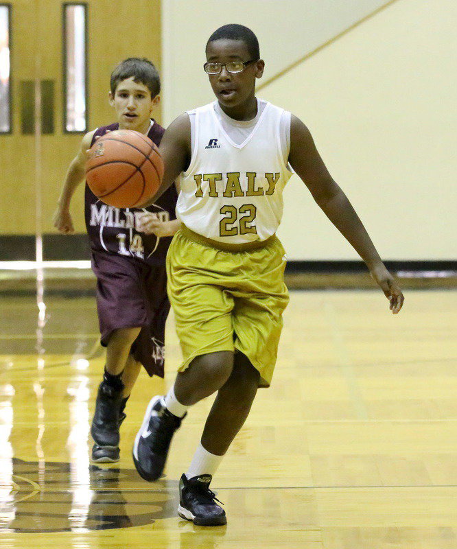 Image: Adam Powell(22) dribbles away from a Mildred defender during the 7B game.