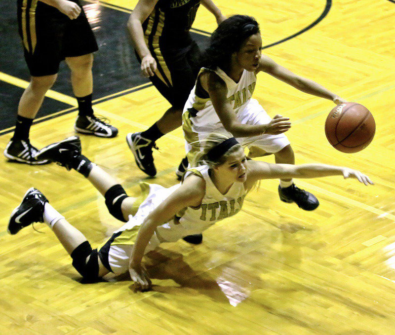 Image: Hustling after a loose ball are Lady Gladiator teammates Halee Turner(3) and Ryisha Coplenad(11). Italy gave visiting 2A Malakoff fits but fall to the Lady Tigers 55-47 in preseason action.