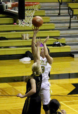 Image: Jaclynn Lewis(13) rises over a Malakoff defender.
