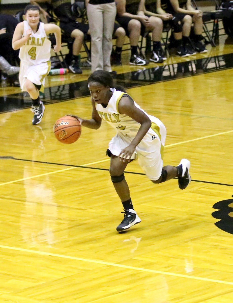 Image: Kortnei Johnson(3) tears way from the Tigers for an easy bucket with teammate Tar Wallis(4) following her to the rim.