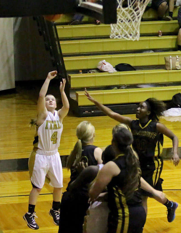 Image: Tara Willis(4) puts up a baseline jumper.