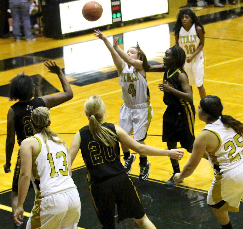 Image: Tara Wallis(5) slips into the paint and puts up a mini-jumper.