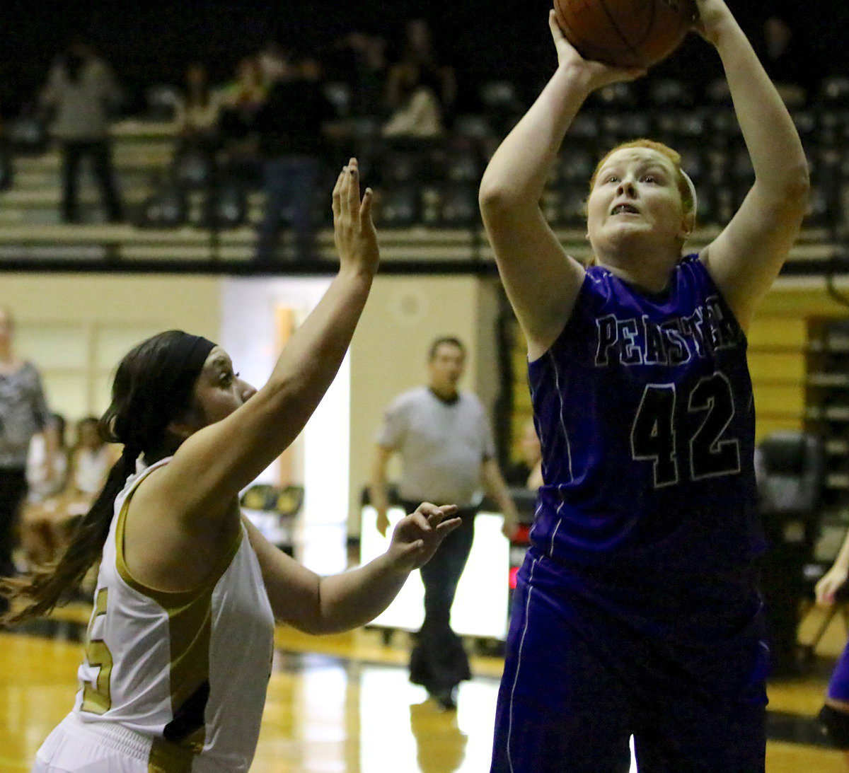 Image: Monserrat Figueroa(25) tries to pressure a Peaster shooter.