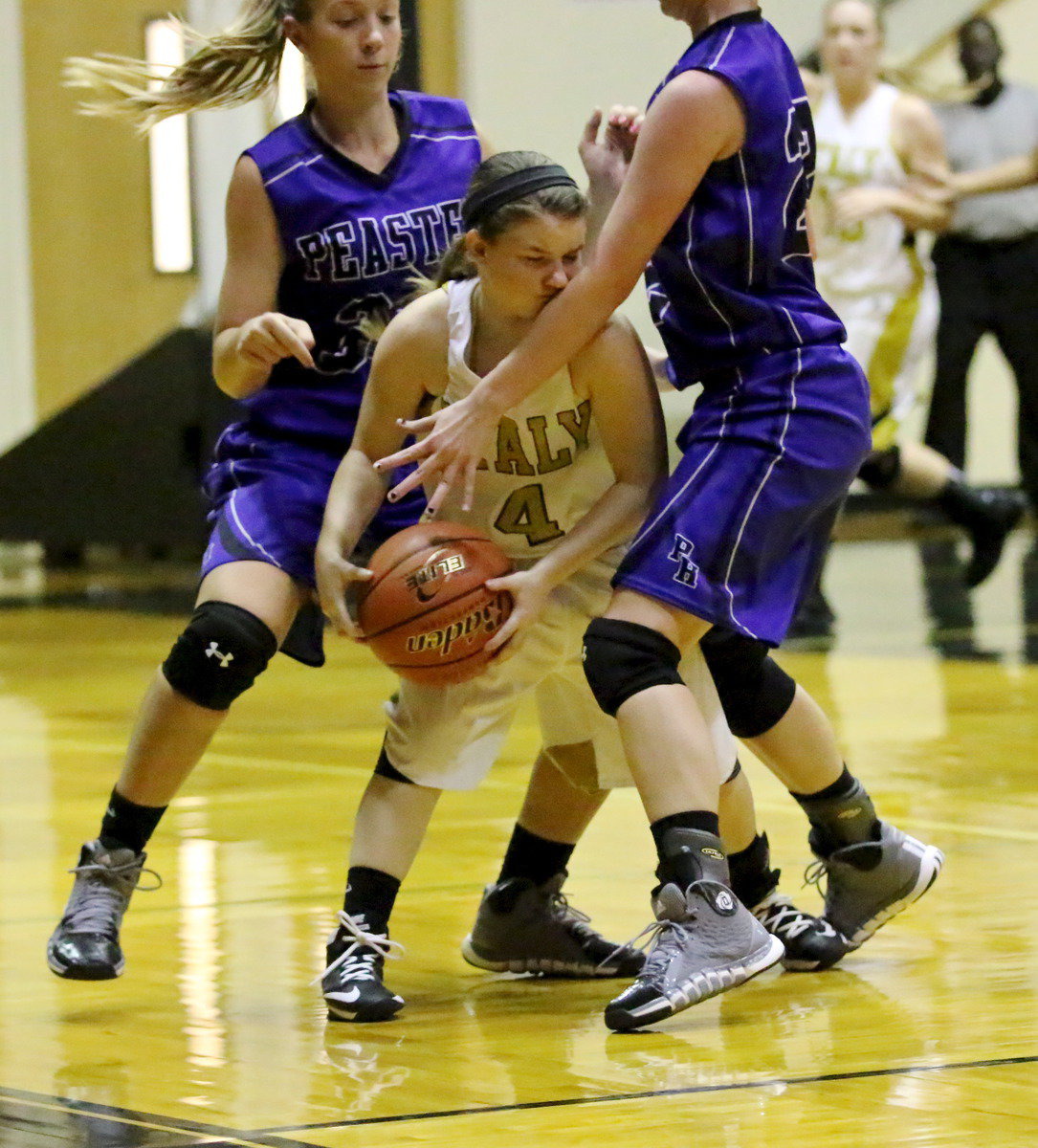 Image: Drawing the foul is point guard Tara Wallis(4).