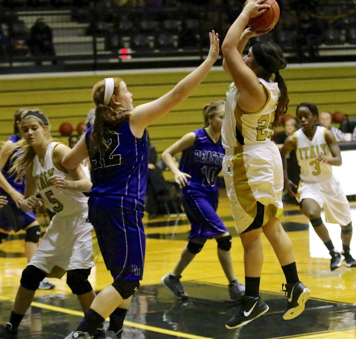 Image: Monserrat Figueroa(25) rises for jump shot.