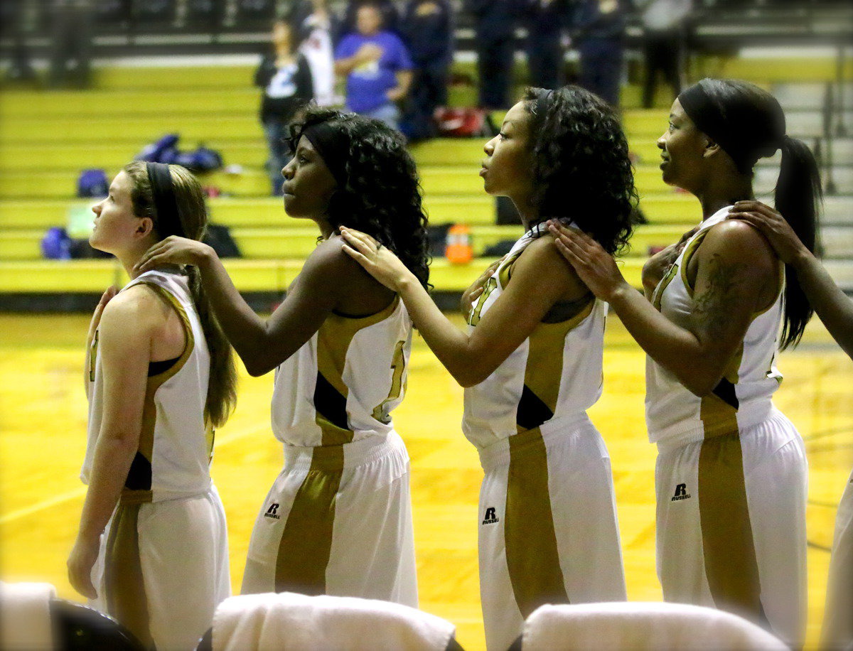 Image: Lady Gladiators Tara Wallis(4), Kendra Copeland(10), Ryisha Copeland(11) and Bernice Hailey(2) prepare for their game against Peaster in first-round of Italy hosted basketball tournament.