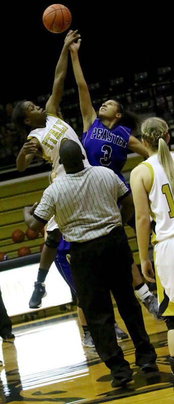 Image: Lady Gladiator Kortnei Johnson(3) gets up for the tip.