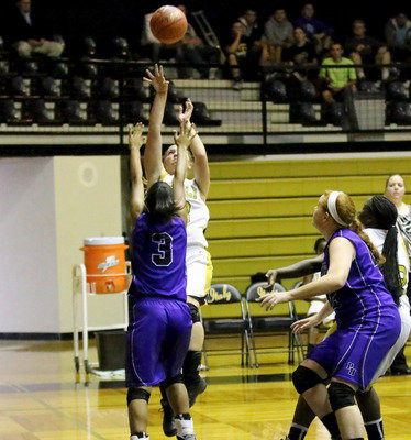 Image: Jaclynn Lewis(13) shoots over a Peaster post player.