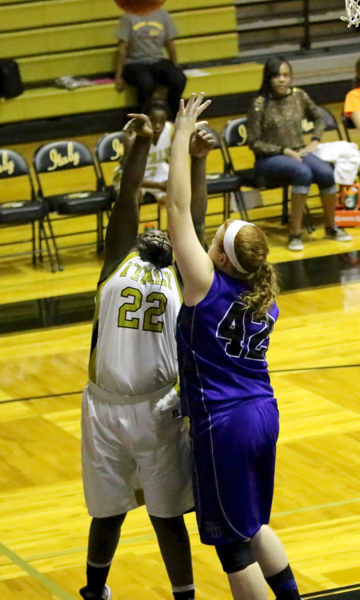 Image: Taleyia Wilson(22) earns a trip to the free-throw line.