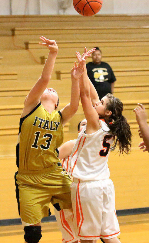 Image: Working the low block, Jaclynn Lewis(13) draws a shooting foul against Kemp.