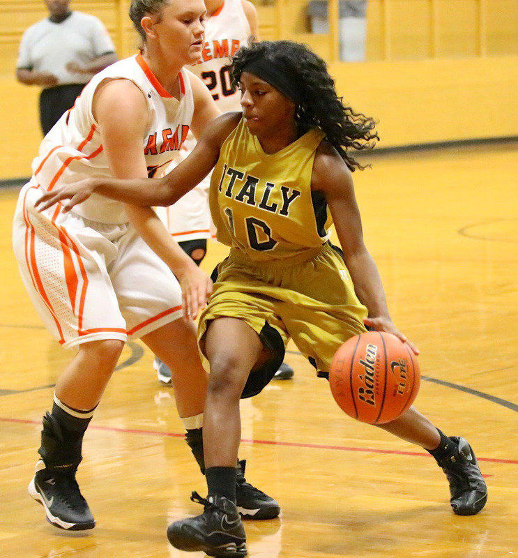 Image: Point guard Kendra Copeland(10) dribbles into Kemp’s defense.