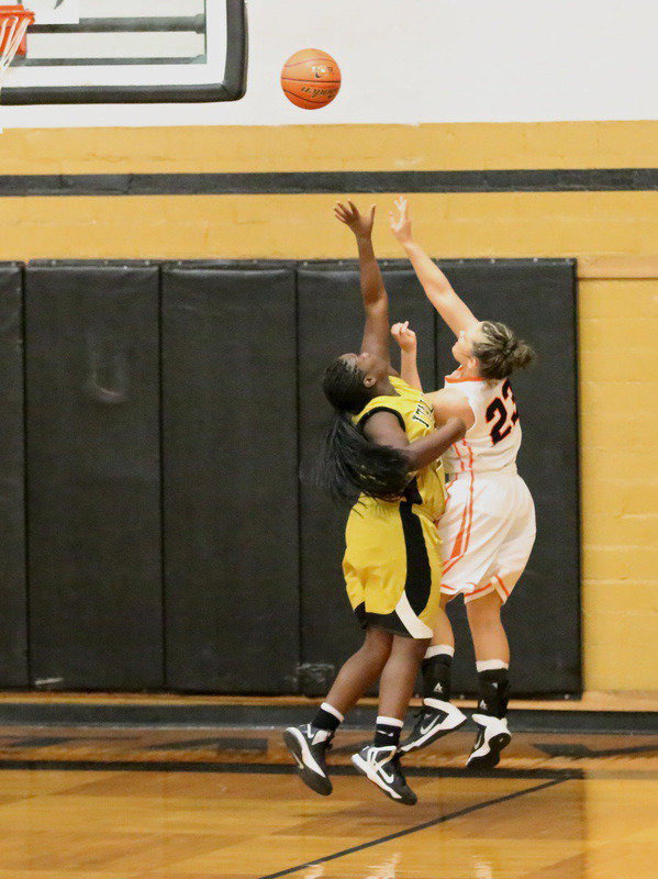 Image: Taleyia Wilson(22) keeps Kemp from scoring an easy basket.