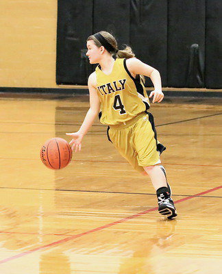 Image: Tara Wallis(4) hurries the ball up the court.
