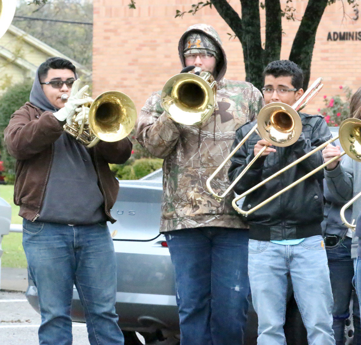 Image: Gladiator Regiment Band members Pedro Salazar, Hunter Wood and Jorge Galvan help inspire the team as they depart for Pennington Field in Bedford.