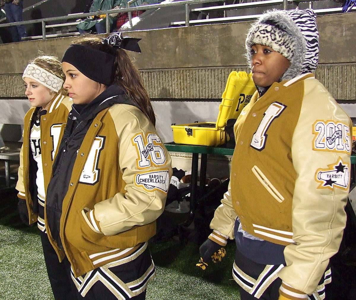 Image: The faces of cheerleaders Britney Chambers, Ashlyn Jacinto and K’Breona Davis say it all as Collinsville brings a sudden halt to Italy’s playoff aspirations.