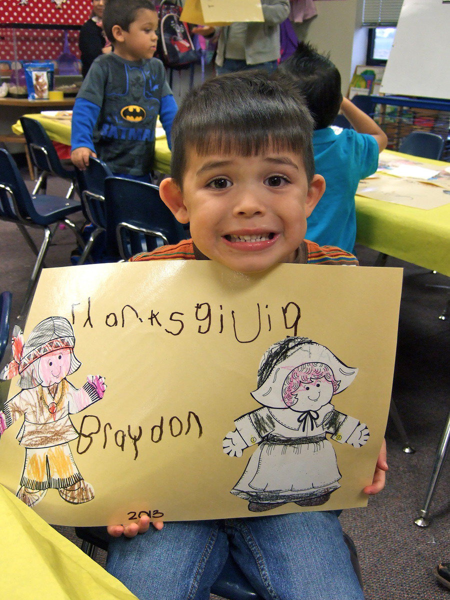 Image: He really likes his placemat he made.