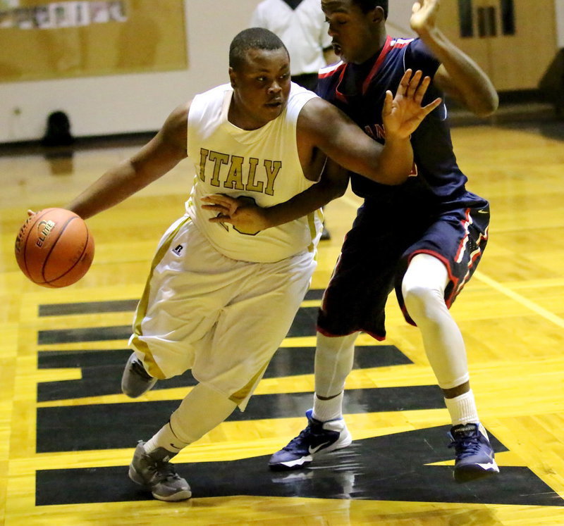 Image: Senior Gladiator Darol Mayberry dribbles thru a Madisonville defender during Italy’s season opener against the visiting Mustangs.