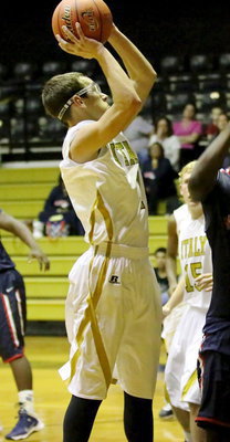 Image: Sophomore Ryan Connor(1) goes up for the shot.