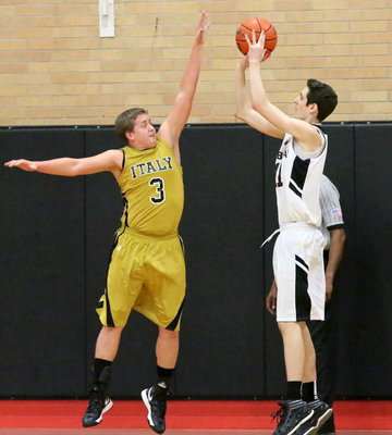 Image: Bailey Walton(3) rises to block a shot attempt by Grandview.