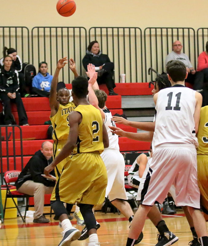 Image: Freshman Kevin Johnson(5) swishes in a 3-pointer from the right corner.