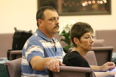 Image: Bobby McBride and his wife Sherry McBride are obviously captivated by the speaking skills of Captain Cate.