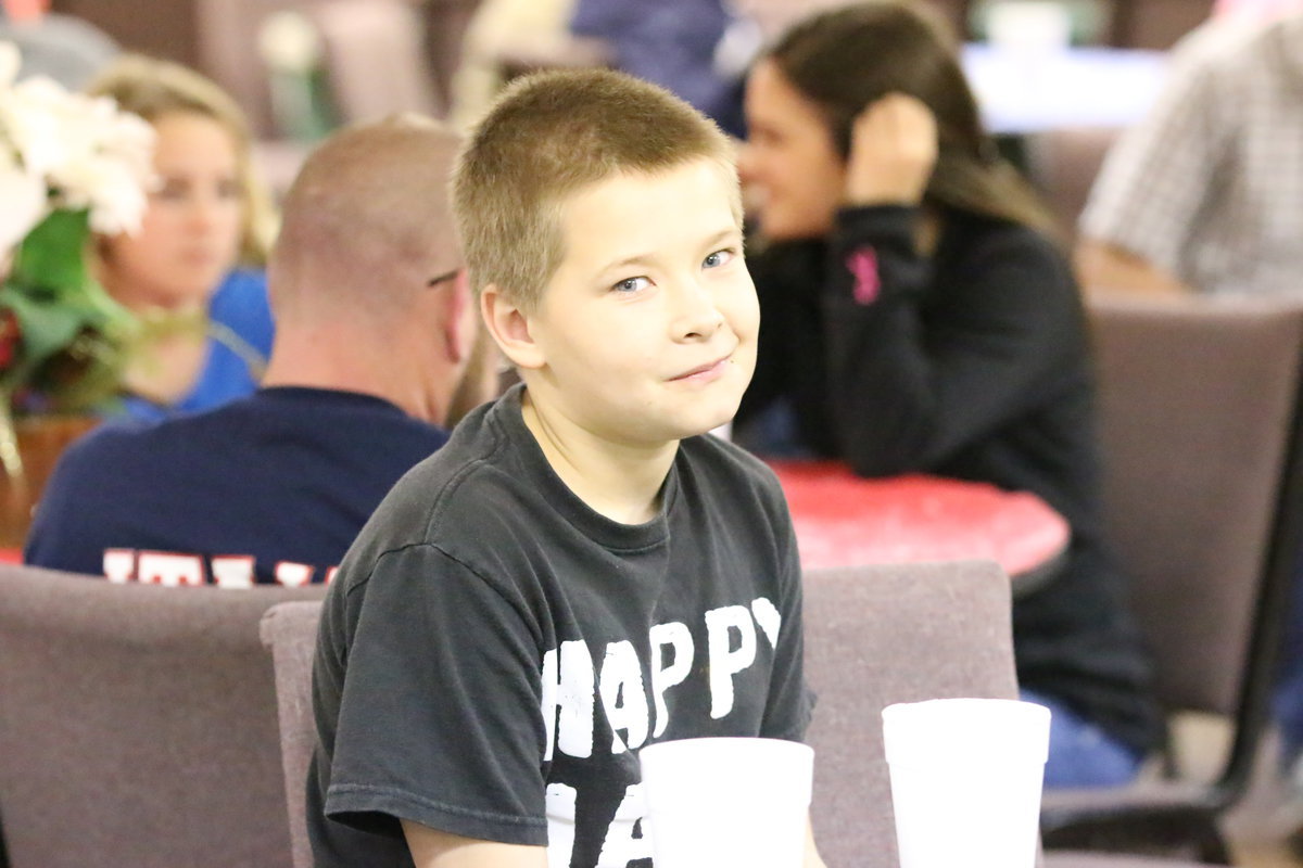 Image: Tanner Chambers enjoys the awards presentation while waiting for his time to help protect the community.