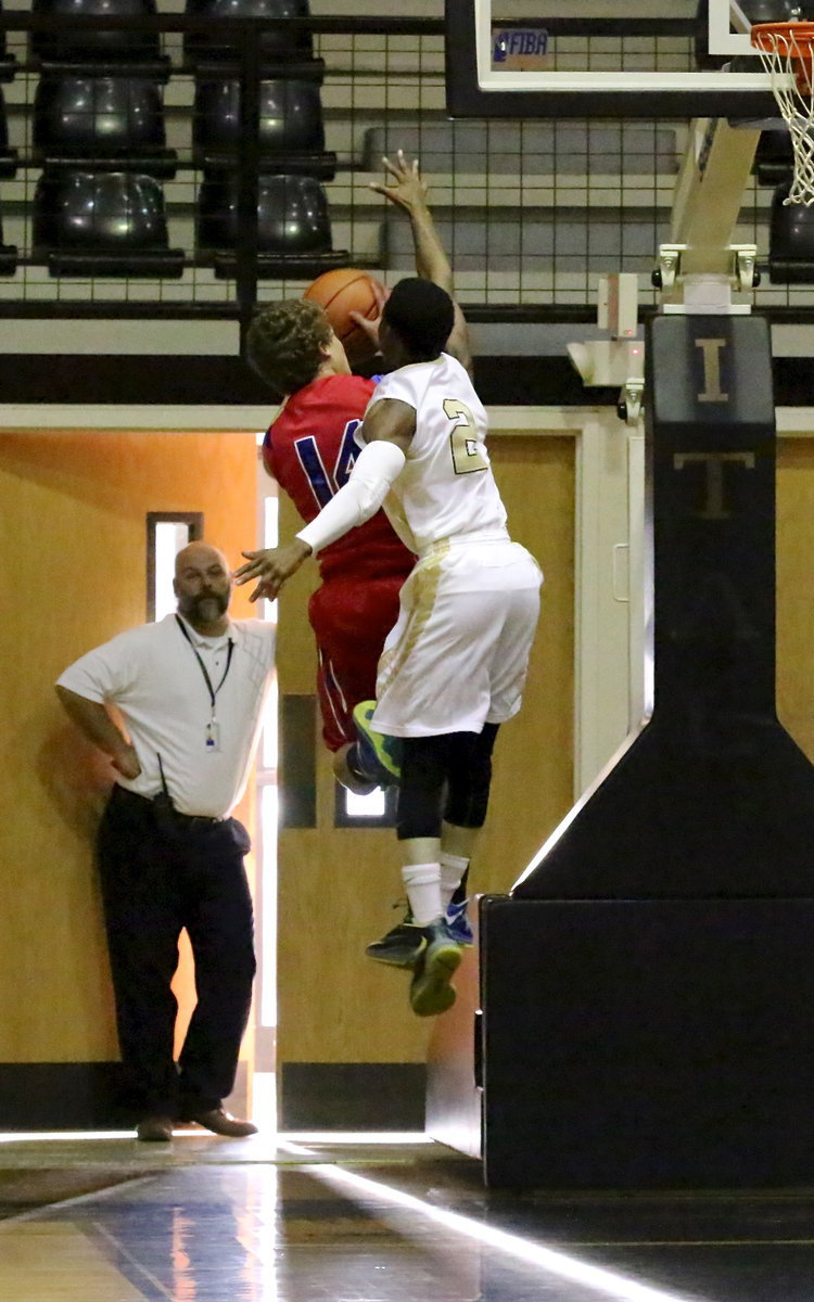 Image: Italy ISD principal Lee Joffre gets a good look at Eric Carson(2) challenging a Mustang shooter.