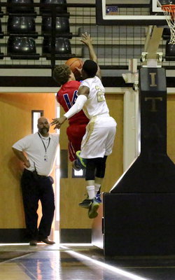 Image: Italy ISD principal Lee Joffre gets a good look at Eric Carson(2) challenging a Mustang shooter.