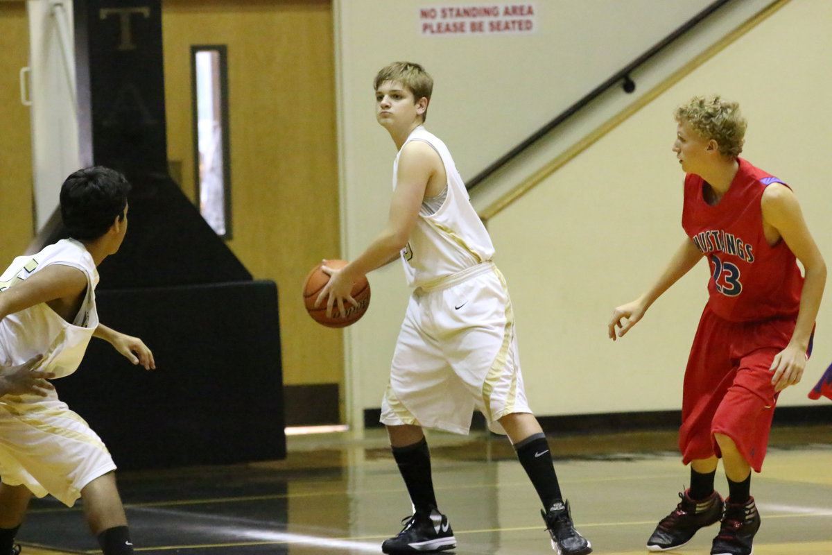 Image: James Walton(13) tries to pass to teammate Jorge Galvan(15).