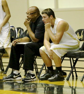 Image: The thinkers: Coach Larry Mayberry, Sr., and Coby Bland contemplate the game of basketball.