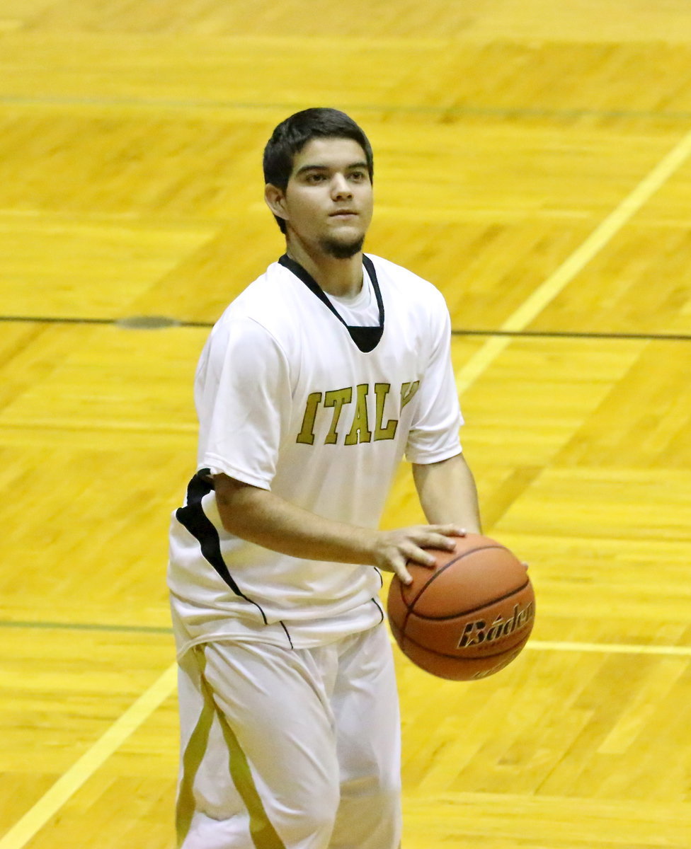 Image: Senior guard Tyler Anderson warms up from long range.