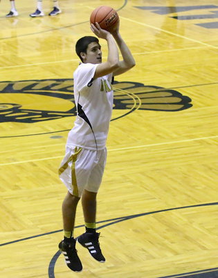 Image: Sophomore Mason Womack warms up to the idea of playing for the varsity.