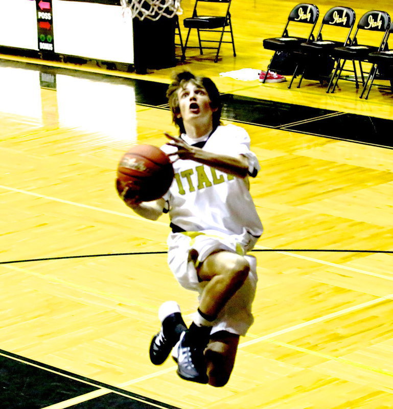 Image: Ty Windham styles during pre-game layups.