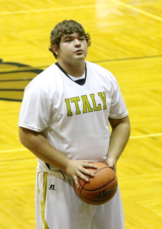 Image: Senior Gladiator Kevin Roldan practices a free-throw.