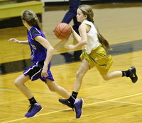 Image: Karley Nelson(1) dribbles the ball up court for Italy’s 7th grade team.